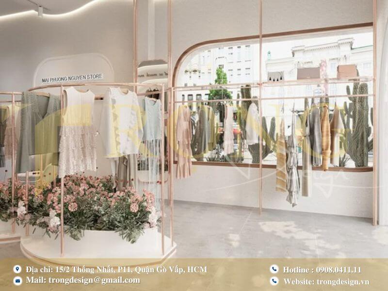 Thiết kế cửa hàng tươi sáng và nữ tính với khung kim loại hồng đồng.