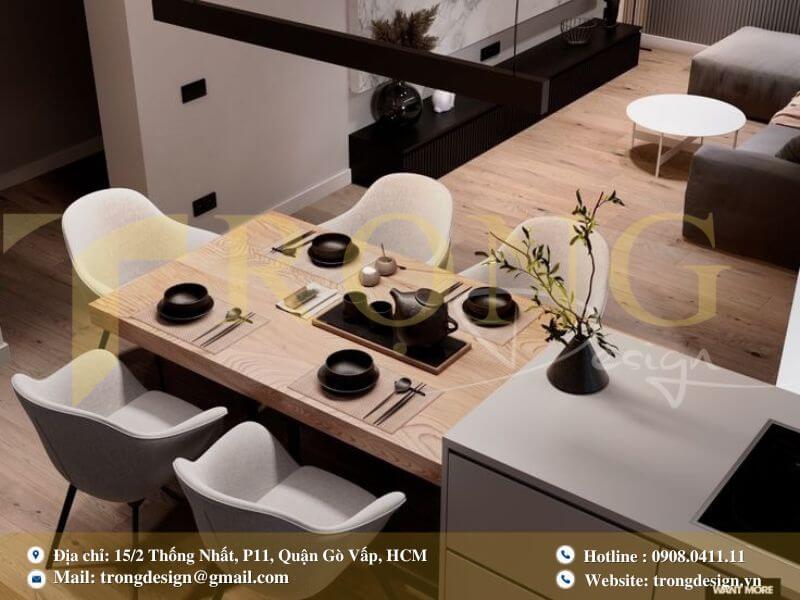 Bếp hiện đại ấm cúng với tủ bếp xám gỗ sáng màu và đèn thả thủy tinh.