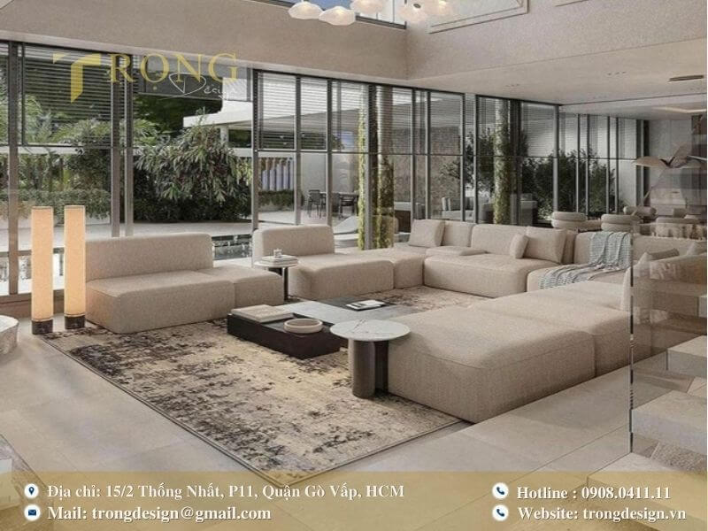 Không gian phòng khách tối giản, hiện đại với ánh sáng và đèn chùm độc đáo.
