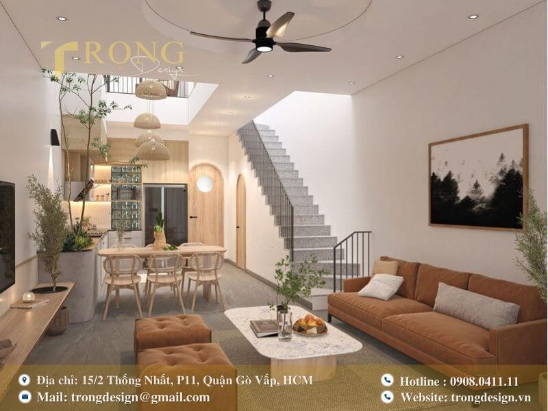 Phòng khách tối giản, pha trộn nét mộc mạc với các chi tiết cong mềm mại.