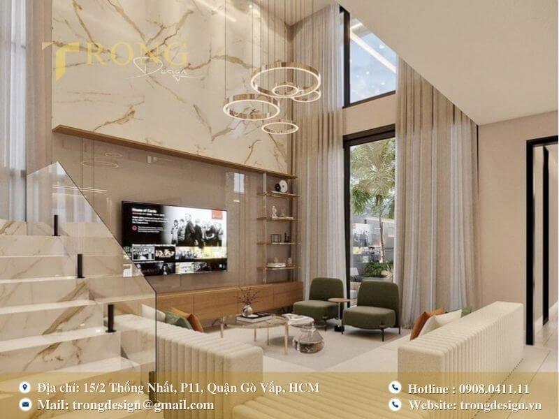 Không gian phòng khách đẳng cấp với tường ốp đá cẩm thạch và ánh sáng tinh tế.
