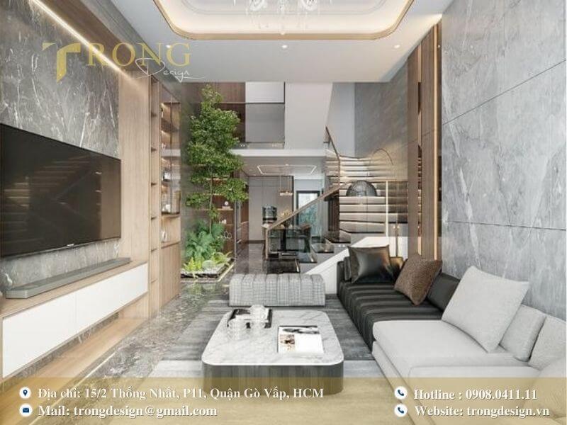 Không gian phòng khách sang trọng với sự kết hợp hài hòa giữa đá cẩm thạch và gỗ.