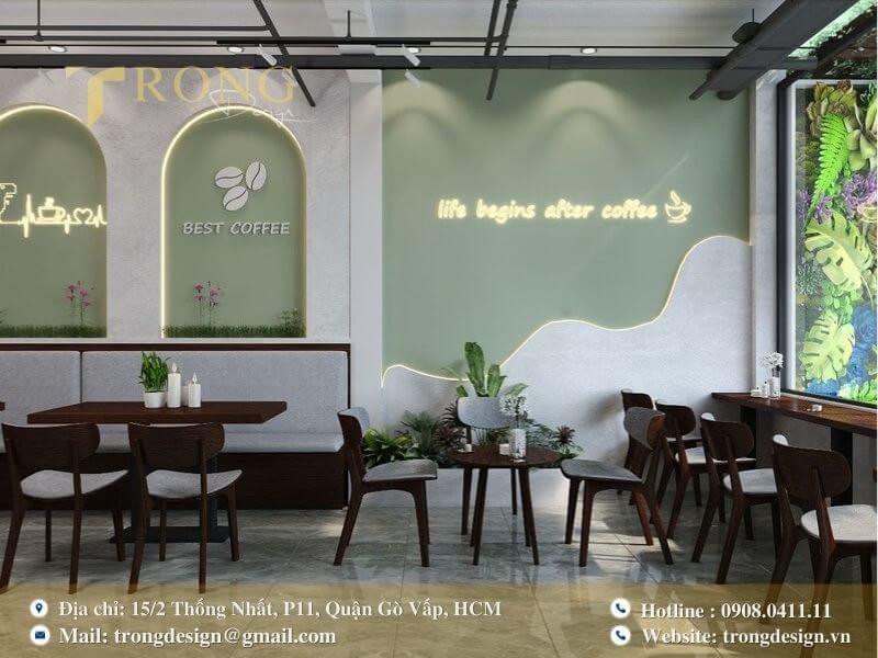 Quán hiện đại với tường màu xanh lá và đèn neon độc đáo.