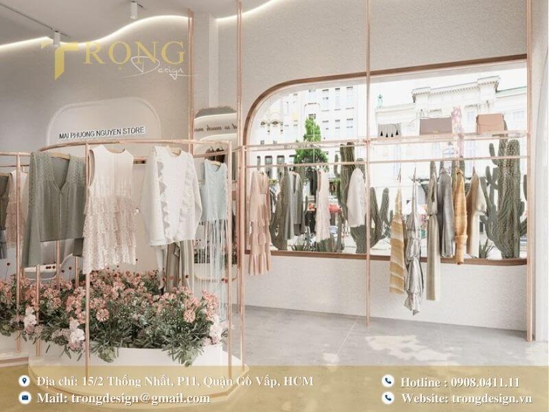 Không gian nhẹ nhàng, tối giản với điểm nhấn là khu vườn hoa và giá treo uốn lượn.